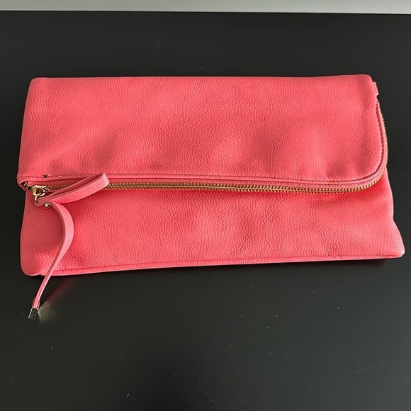 Charming Charlie Handbags - Charming Charlie Coral Folding Clutch
